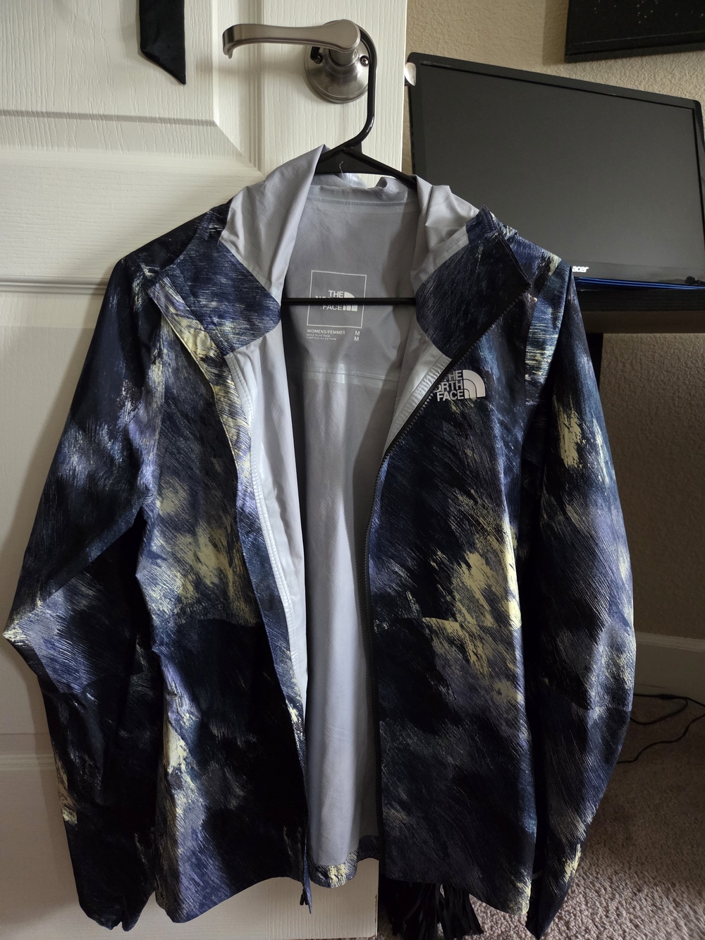 The North Face Womens Navy Jacket with Yellow Brushstroke Pattern